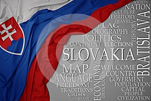 Waving colorful national flag of slovakia on a gray background with important words about country