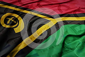 waving colorful national flag of Vanuatu on a euro money banknotes background. finance concept