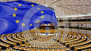Waving European Flag at indoor Parliament in Bruxelles composition footage