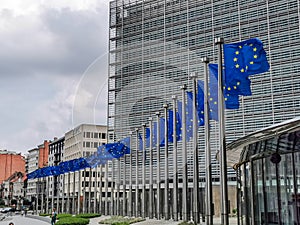 Waving European flags in front EU Commission building