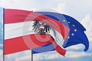 Waving European Union flag and flag of Austria state. Closeup view, 3D illustration.