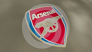 Waving flag with Arsenal football team logo, close-up. Motion. Colorful professional english football club flag