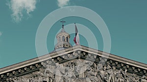Waving the flag of France in the capital Paris on the flagpole of the Pantheon building. Slow motion, The day, against