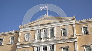 Waving flag on the Greek parliament building in Athens, Greece