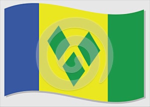 Waving flag of Saint Vincent and the Grenadines vector graphic. Waving Vincentian flag illustration. Saint Vincent and the photo