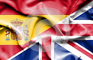 Waving flag of United Kingdon and Spain photo