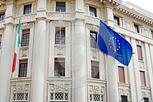 Waving flags of European Union and Italy on governmental building in Cagliary, Sardinia