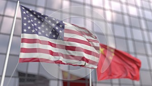 Waving flags of the USA and China in front of a modern skyscraper facade. 3D rendering