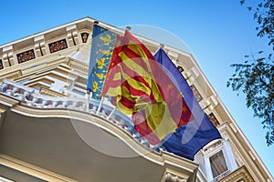 Waving flags of Valencia, Spain and European Union (EU)