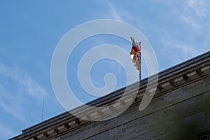 Waving German flag against a blue sky. photo