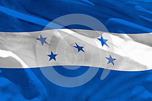 Waving Honduras flag for using as texture or background, the flag is fluttering on the wind photo