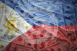 Waving philippines flag on a american dollar money background