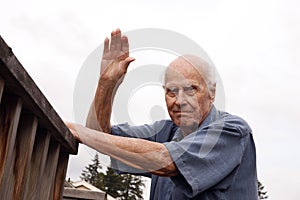 Waving Senior Neighbor Outdoors