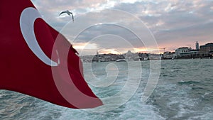 Waving Turkish Flag and cityscape of Istanbul on the background