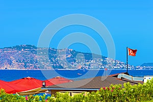 Waving Turkish flag on roof building