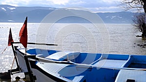 Waving of Turkish flag in Uluabat lake background.