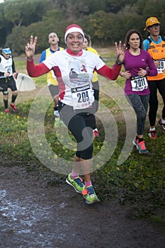 Waving woman in Marathon of the Epiphany, Rome, Italy