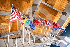 Waving world flags on top of a wooden building