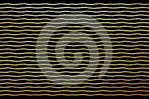 Wavy glittering golden stripes or waves background