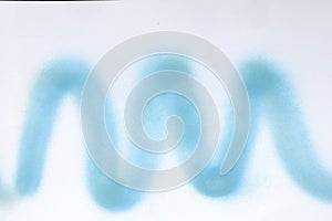 wavy line of blue, spray paint on white paper