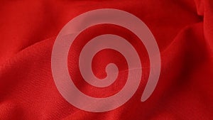 Wavy red cloth, ondulate textile close up view