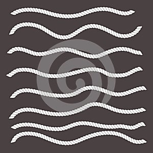 Wavy shapes horizontal white ropes on black background.