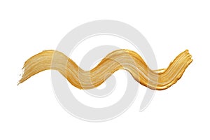 A wavy smear of gold paint, brush. Vector design element, overlay.