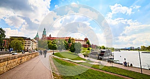 Wawel castle - famous landmark in Krakow Poland. Picturesque landscape on coast Vistula river during the sunny day