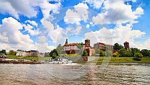 Wawel castle - famous landmark in Krakow Poland. Picturesque landscape on coast Vistula river during the sunny day