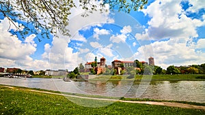 Wawel castle - famous landmark in Krakow Poland. Picturesque landscape on coast Vistula river during the sunny day