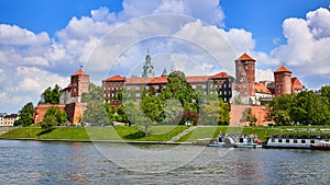 Wawel castle - famous landmark in Krakow Poland. Picturesque landscape on coast Vistula river during the sunny day