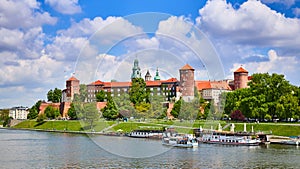 Wawel castle - famous landmark in Krakow Poland. Picturesque landscape on coast Vistula river during the sunny day