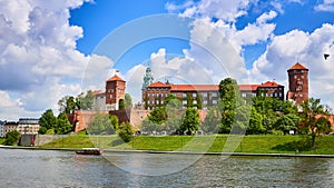 Wawel castle - famous landmark in Krakow Poland. Picturesque landscape on coast Vistula river during the sunny day