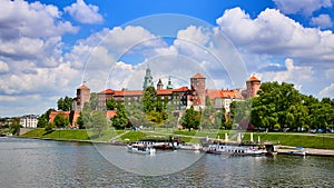 Wawel castle - famous landmark in Krakow Poland. Picturesque landscape on coast Vistula river during the sunny day