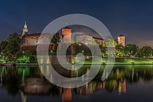 Wawel Royal Castle surrounded by a lake in the evneing in Krakow, Poland