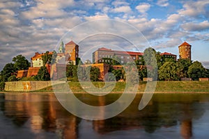 Wawel Royal Castle surrounded by a lake in the evneing in Krakow, Poland