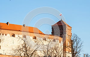 Wawel Royal Castle. Thieves Tower with the flag of Poland on the top