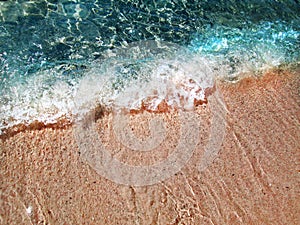 Wawes on the pink beach photo