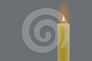 A wax candle burned on a gray background. Copy space