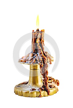 Wax candle in the dust with cheap plastic candle holder isolated on white background.