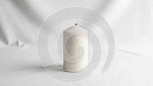 In wax the candle features a simple clean design emphasizing its