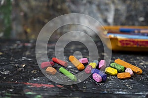 Wax crayons on black background