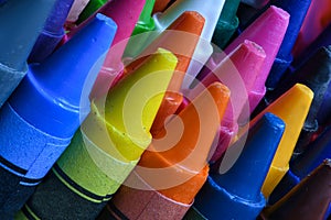 Crayons stacked at random macro close up
