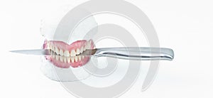 Wax denture with a knife