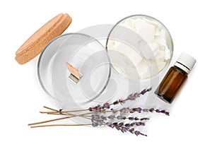 Wax flakes, dry lavender and essential oil on white background, top view. Making homemade candle