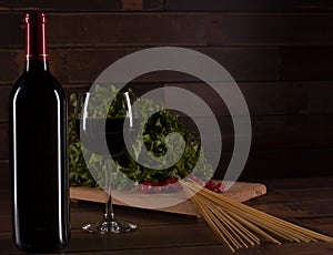 Prepare the romantic dinner with pasta, salad and red wine, in Mexico photo