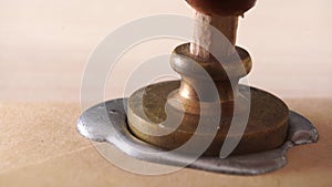 Wax stamp to create a three-dimensional impression.