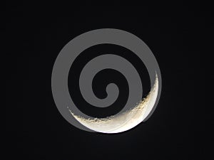Waxing crescent lunar moon around 23 percent