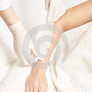 Waxing woman body. Sugar hair removal. laser service epilation. Salon wax beautician procedure