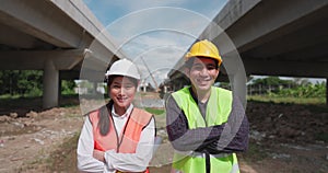 In the way background, skyscraper concrete formwork frames, and a portrait of a confident female construction worker at a